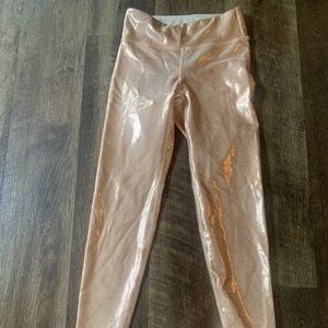 Heroine Sport leggings. Glittery/metallic/copper/goldish color, size M.